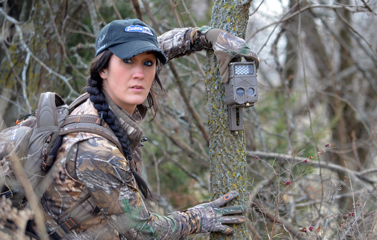 Lady hunter setting her trail camera to do some scouting