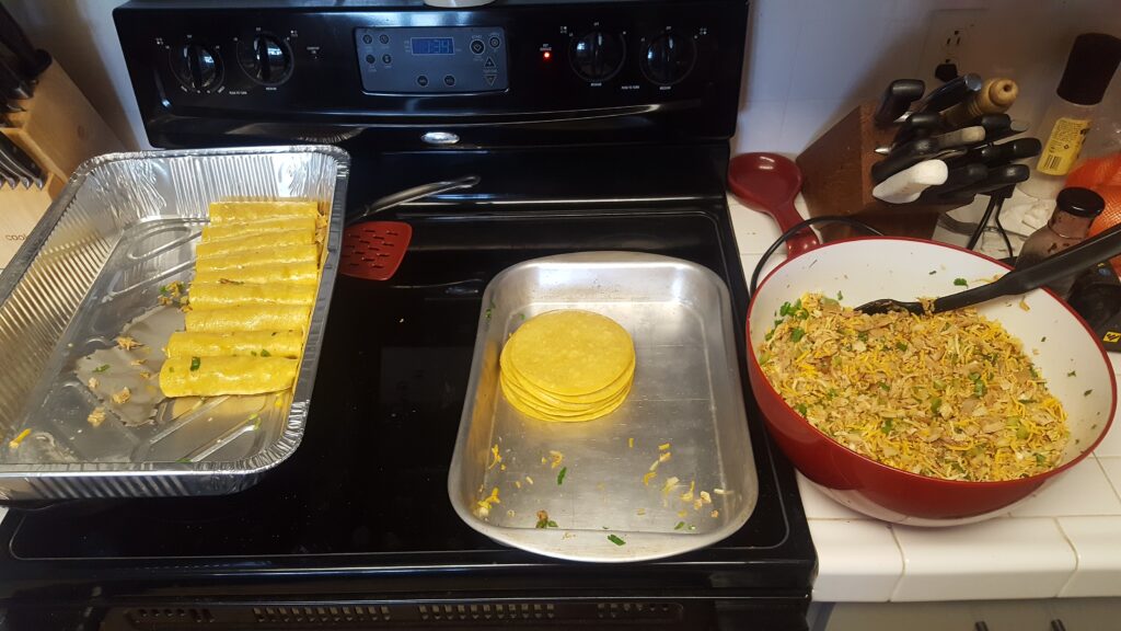 Hunt meal planning - rolling chicken enchiladas ahead of time and freezing for our DIY Elk hunt.