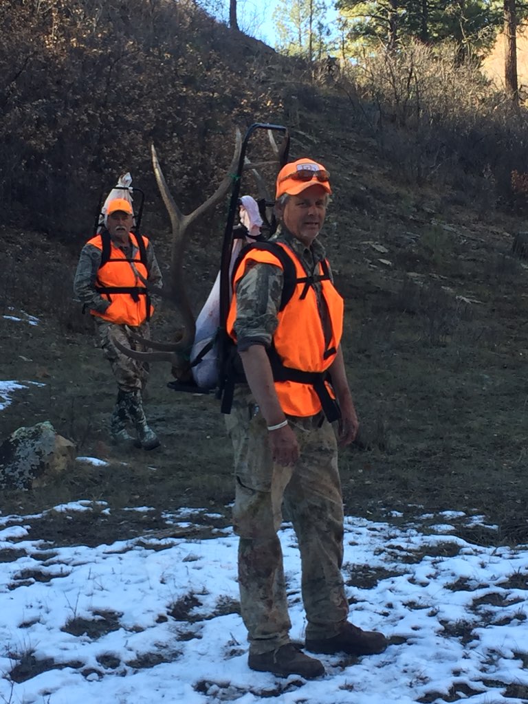 Physical conditioning - Rex McMahon and Ken Kuhn packing out a bull elk on their backs.