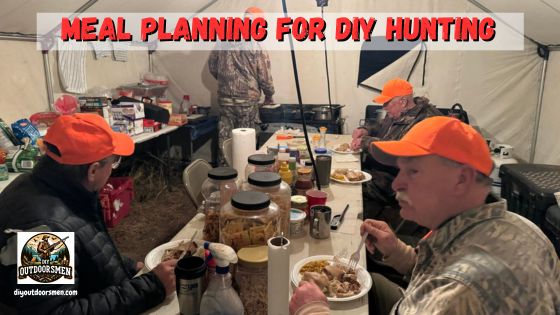 Hunting meal planning tips - photo inside of our cook tent with everyone enjoying a hot meal
