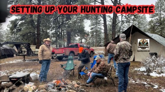Tips for Setting up a Hunting Campsite - photo showing a group of hunters around the campfire with their camp setup in the background