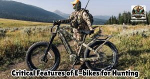 Critical Features of E-bikes for Hunting featured image showing a hunter in full camo and carrying his rifle, standing next to his hunting e-bike.