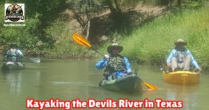 Devils River Kayaking Trip featured image showing three kayakers coming down the river.