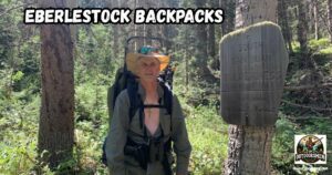 Eberlestock Backpacks featured image showing the author with pack on his back standing next to the South San Juan Wilderness Trail Marker.