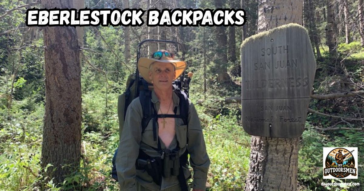 Eberlestock Backpacks featured image showing the author with pack on his back standing next to the South San Juan Wilderness Trail Marker.